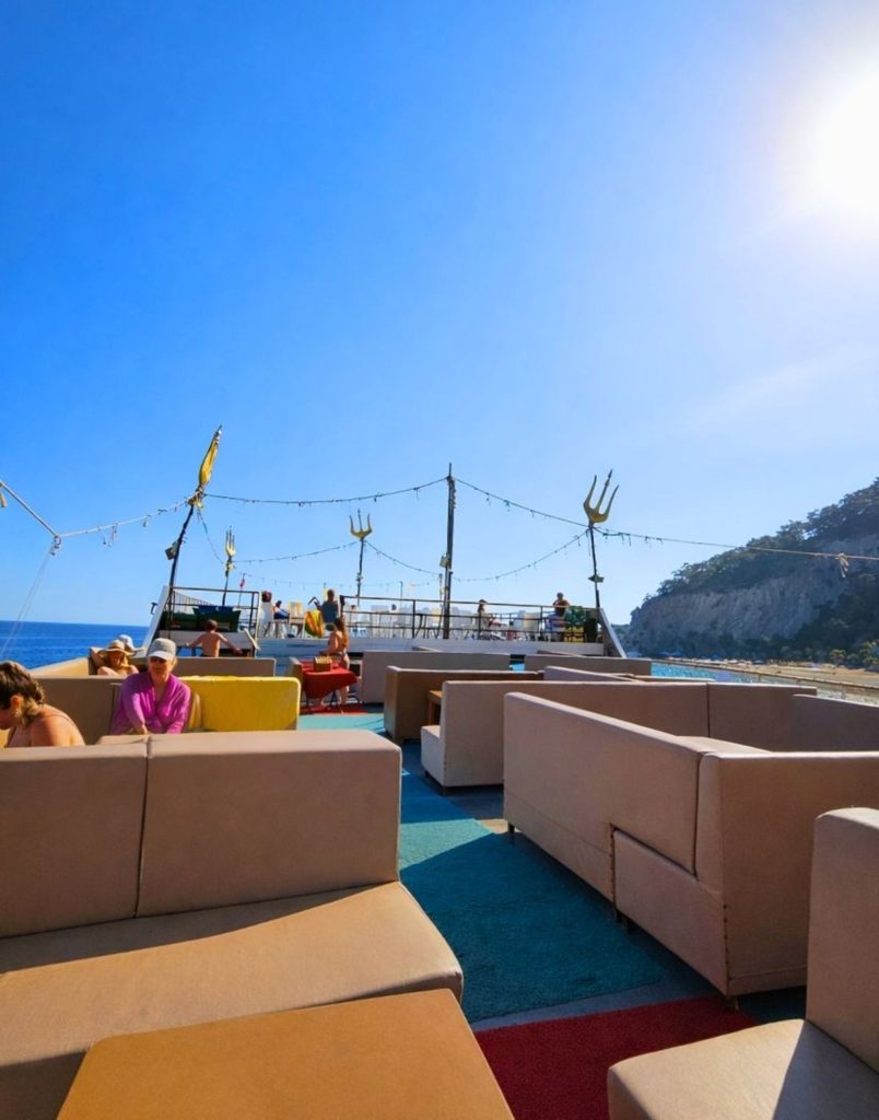 VIP lounge area with comfortable sofas on Mega Star boat deck in Antalya