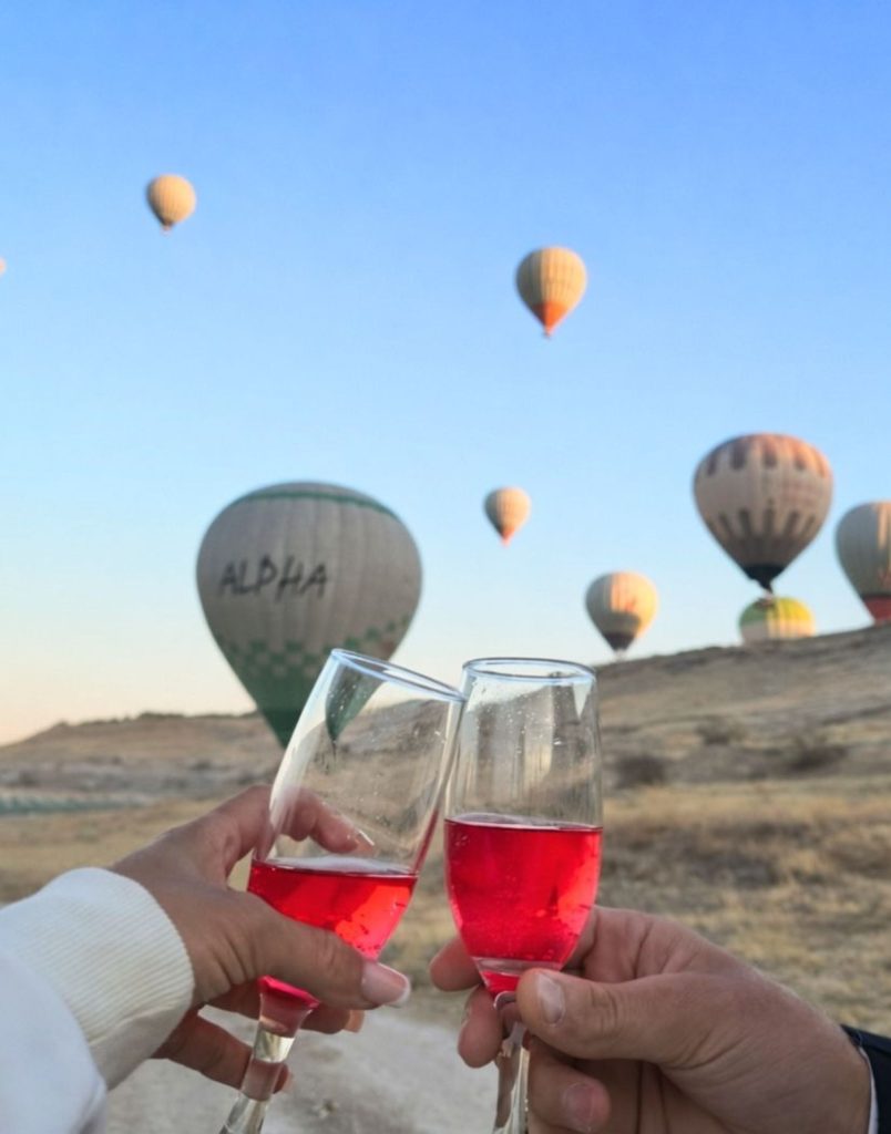 Champagne toast with hot air balloons at sunrise in Pamukkale during Antalya balloon tour