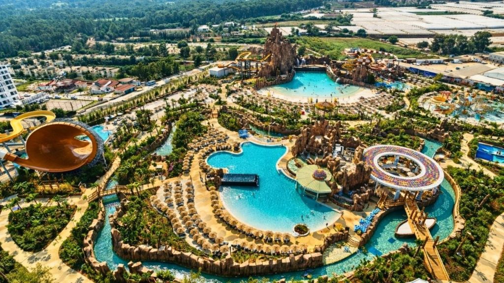 Aerial view of Land of Legends theme park with water slides pools and attractions in Antalya