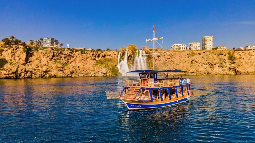 Tour boat in front of Duden Waterfall during Antalya Waterfall Boat Trip