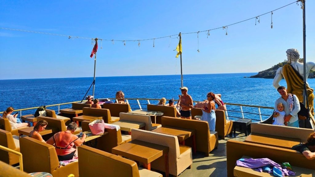 Mega Star boat trip upper deck seating area with open sea view Mediterranean coast