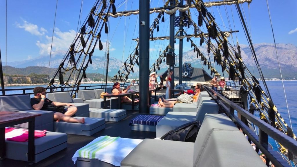 Belek pirate boat trip upper deck lounge sofas Taurus mountain views Mediterranean