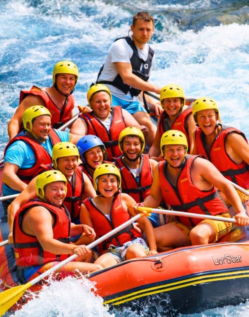 belek rafting full boat with helmets and life vests on white water rapids
