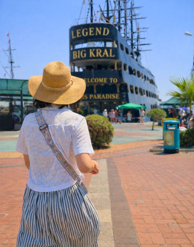 Visitor walking towards Legend Big Kral pirate ship entrance at Alanya harbour