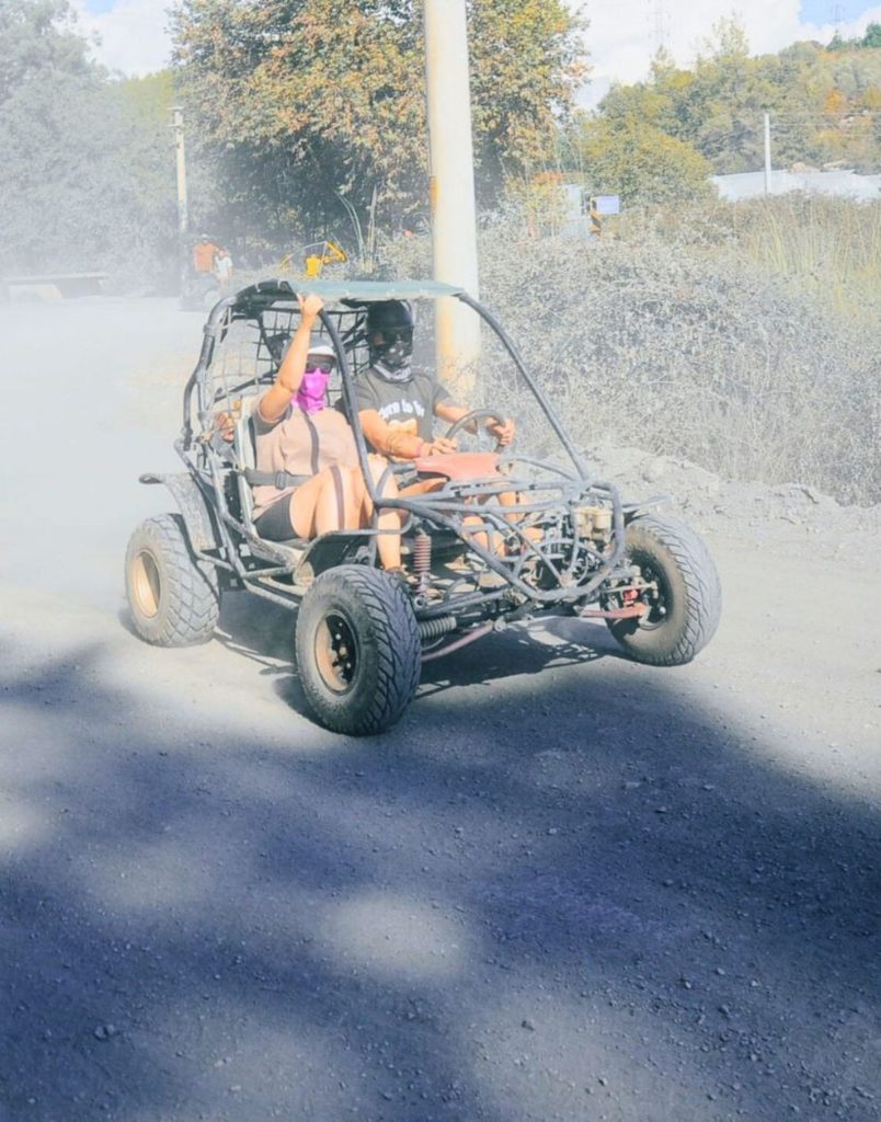 Buggy creating dust cloud on dirt track on Alanya buggy safari tour