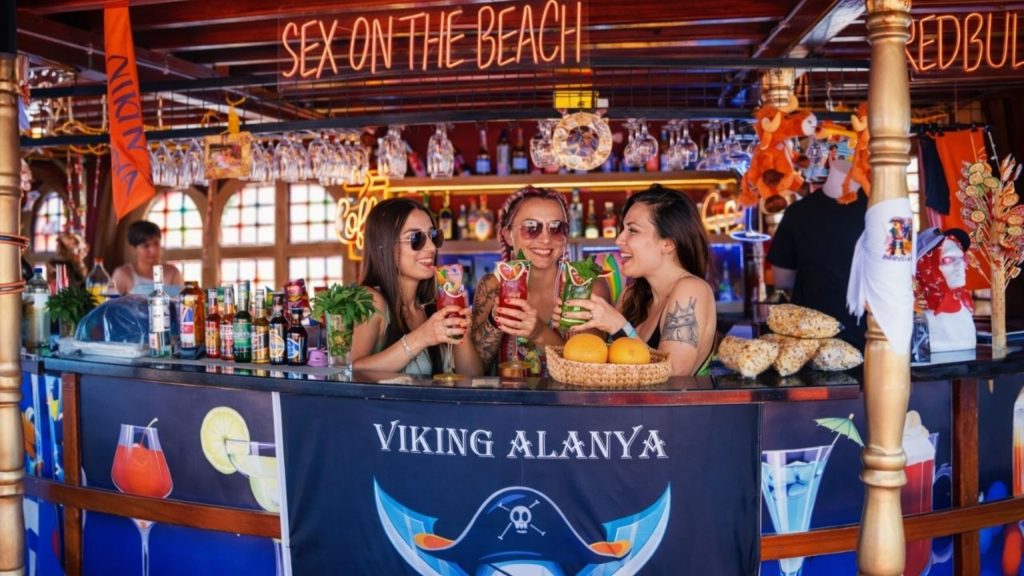 Viking Alanya pirate boat bar with colourful cocktails and neon signs