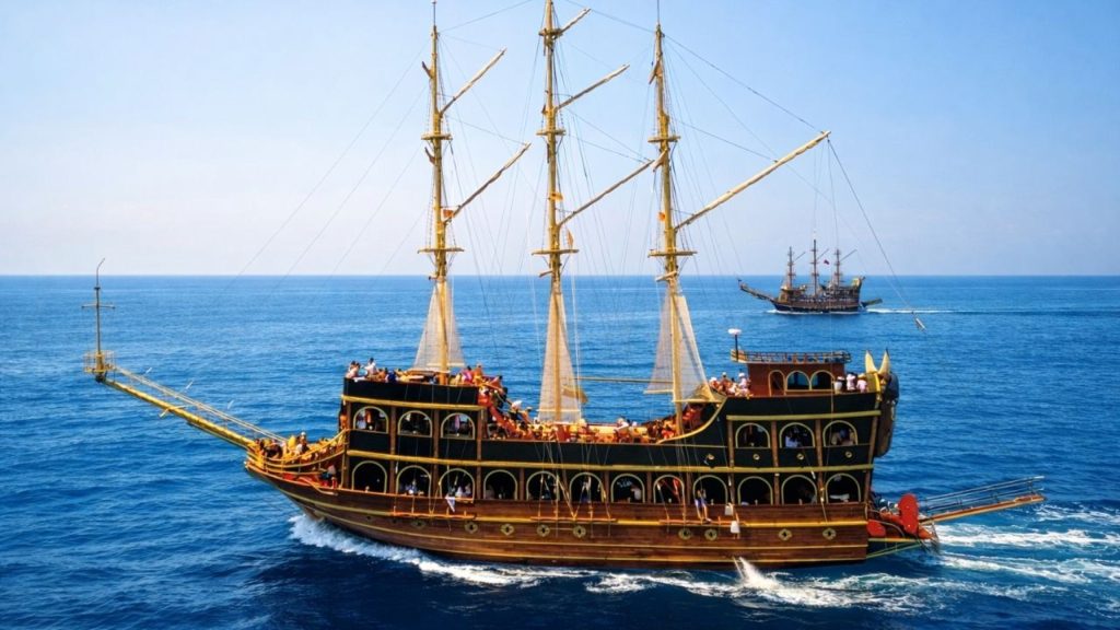 Two pirate boats sailing on deep blue Mediterranean sea along Alanya coast