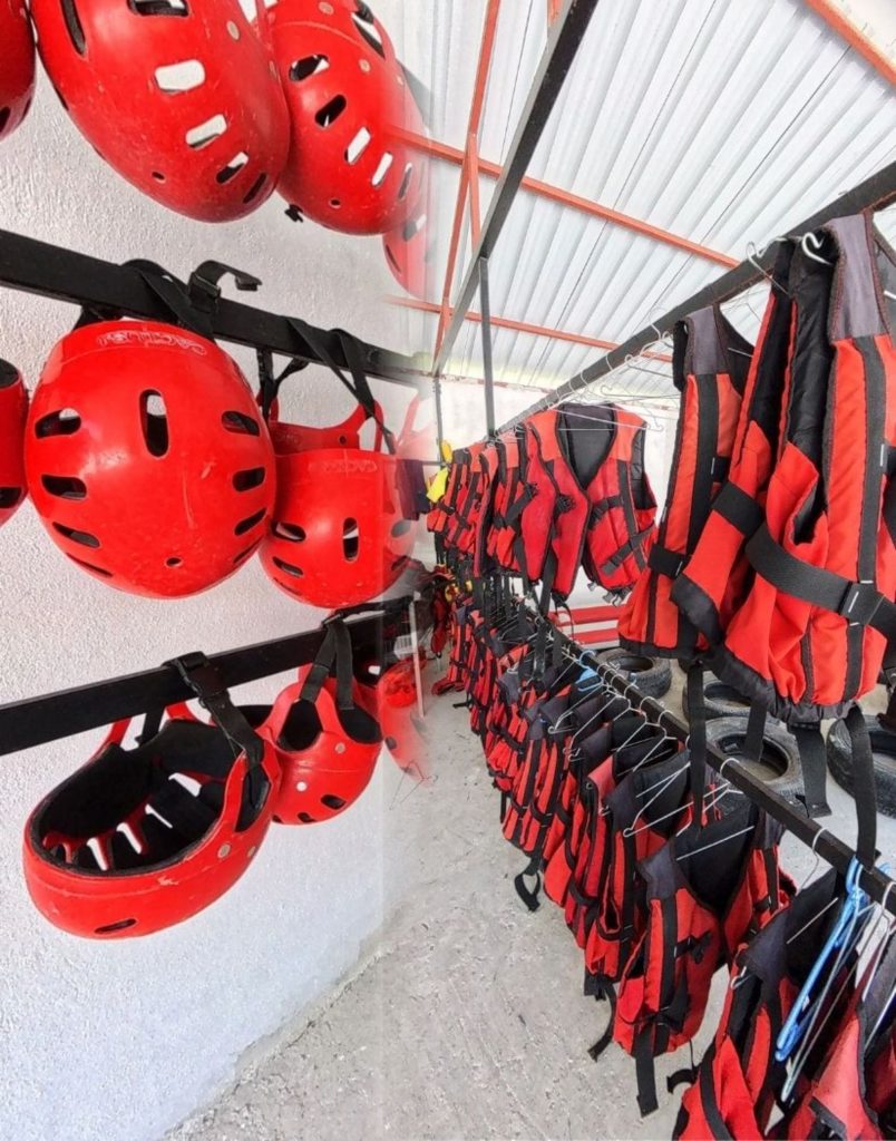 Red safety helmets and life jackets at the Alanya rafting base
