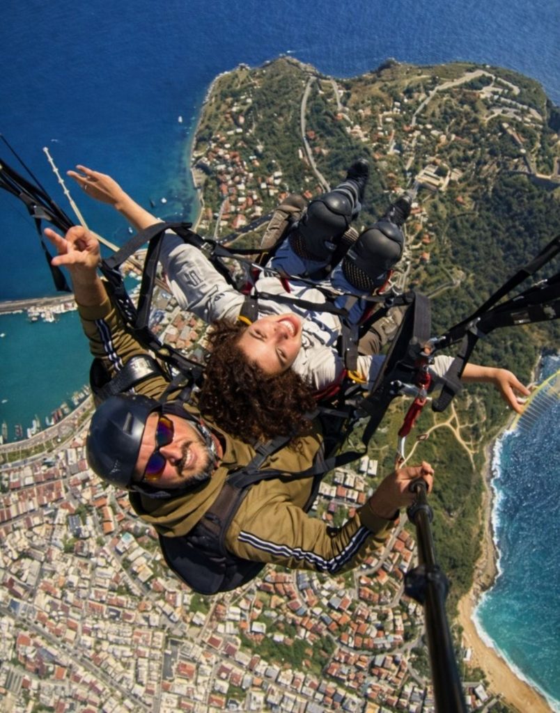 Tandem paragliding selfie over Alanya Castle peninsula and harbour