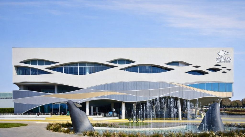 antalya aquarium from side modern wave shaped building exterior with fountains
