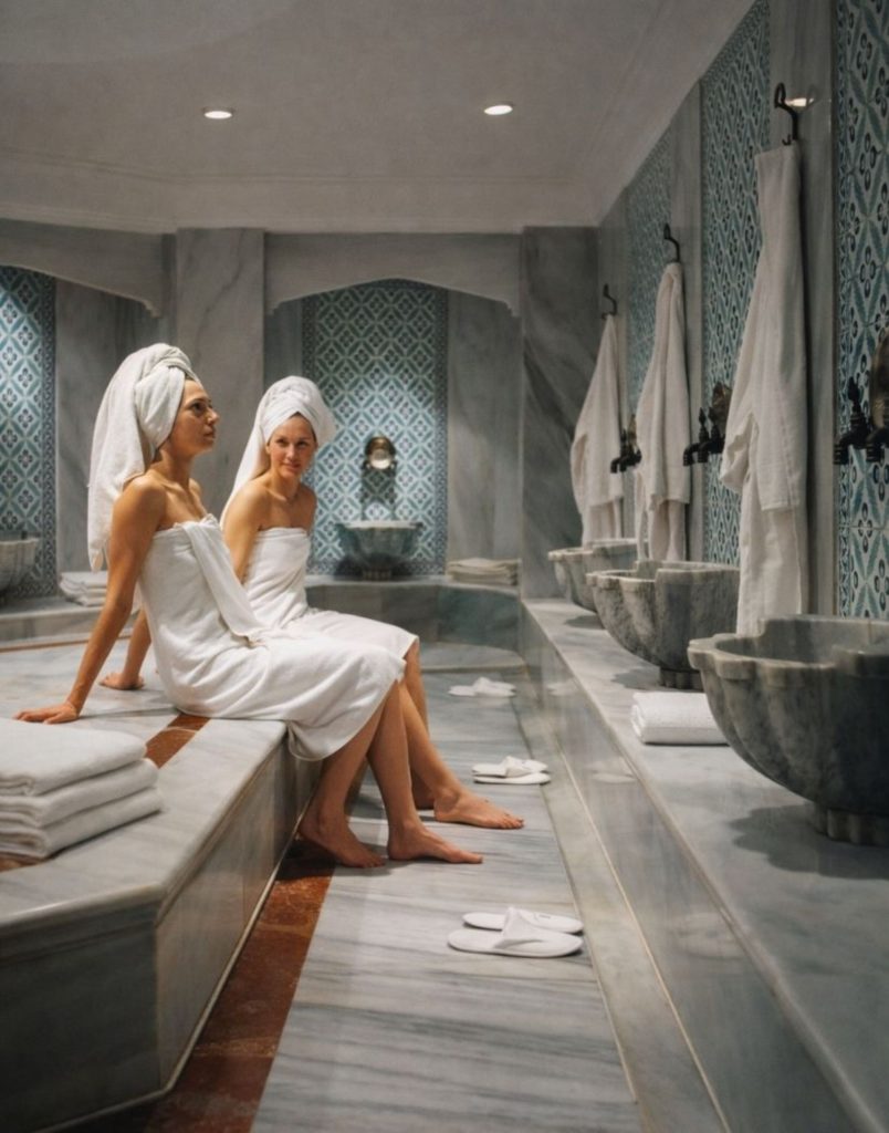 Belek Turkish bath marble interior with traditional blue ceramic tiles and washing basins