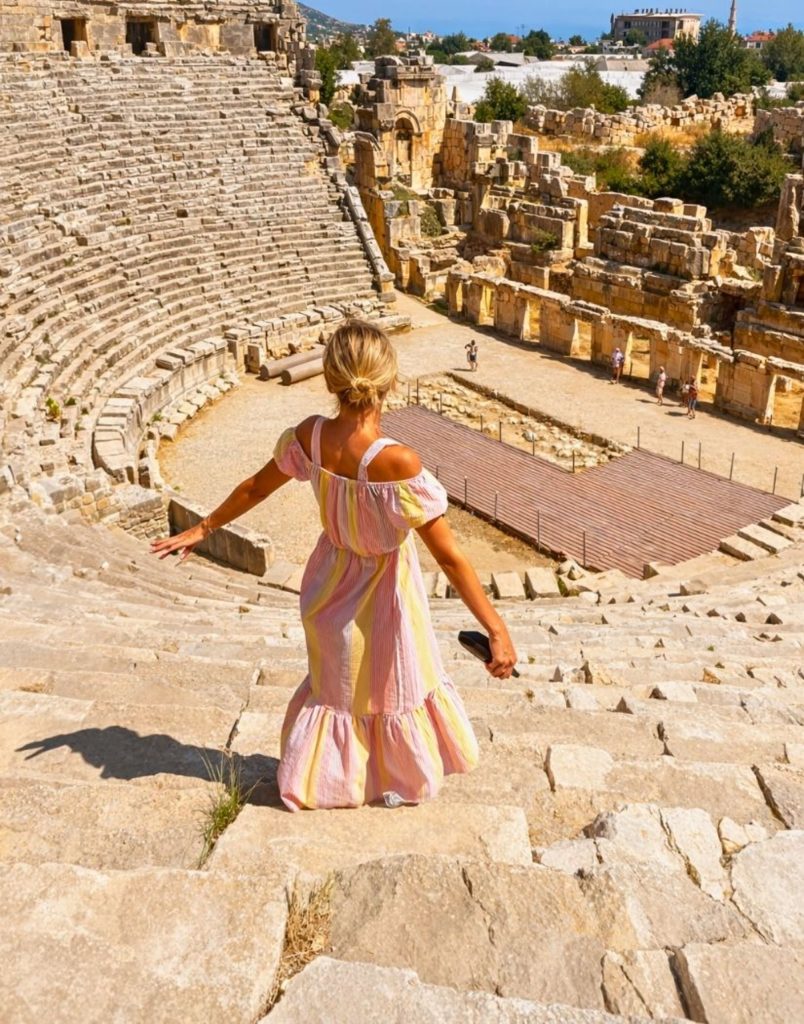 Visitor exploring the ancient Roman amphitheatre at Myra on Demre Myra Kekova tour from Alanya
