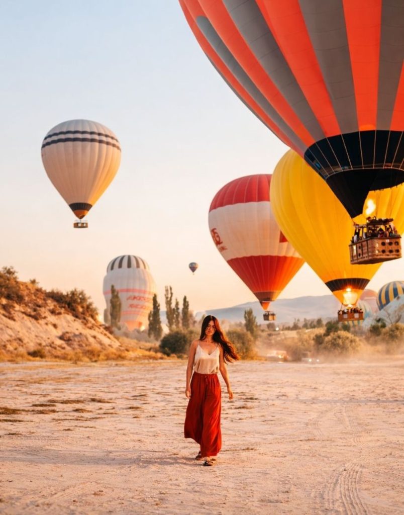 Cappadocia sunrise hot air balloon flight colourful balloons golden morning light