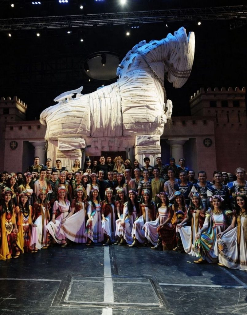 Full cast of 120 dancers with giant Trojan Horse on stage at Troy show Aspendos