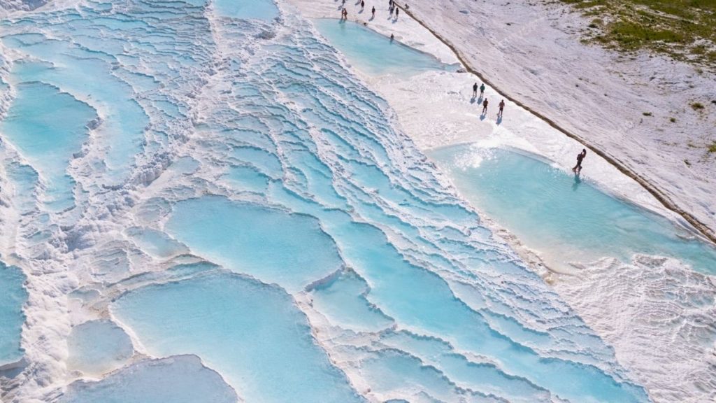 Pamukkale travertine terraces aerial panoramic view white calcium pools turquoise water