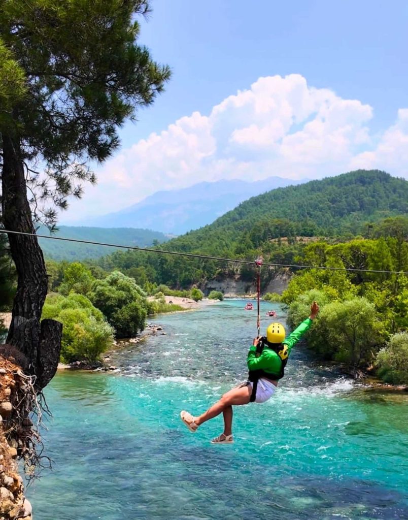 Antalya zipline over turquoise Koprulu Canyon river with Taurus Mountains in background