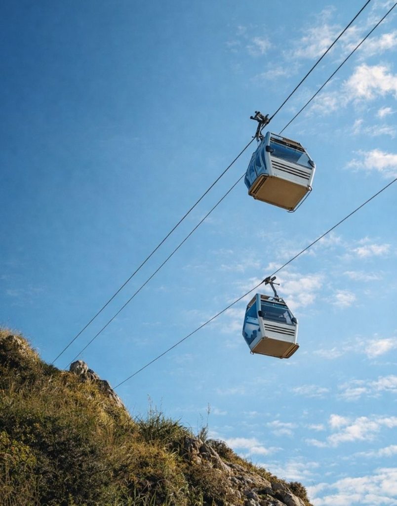 alanya city tour from side two cable car gondolas against blue sky over the castle hill
