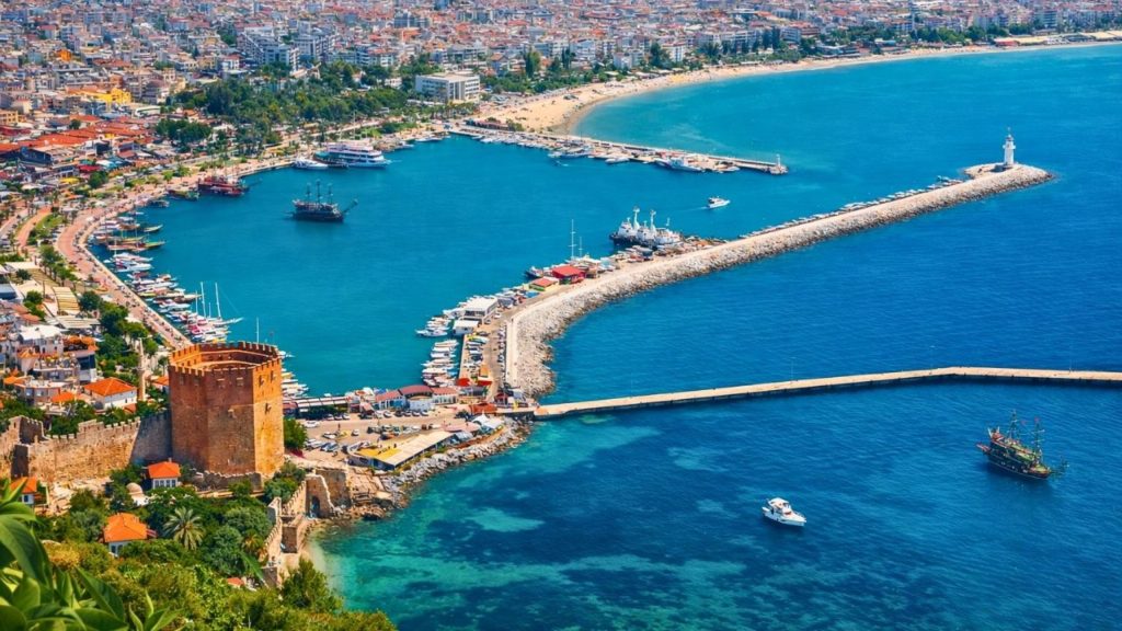 alanya city tour from side aerial view of the harbor red tower lighthouse and beach