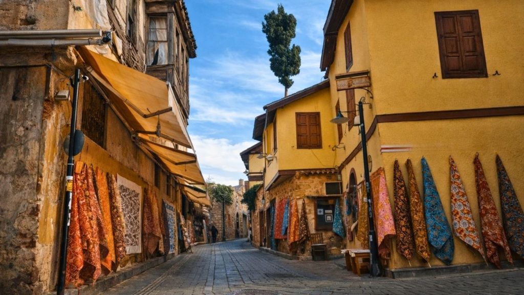 antalya city tour from side kaleici old town cobblestone street with colorful textiles and ottoman houses