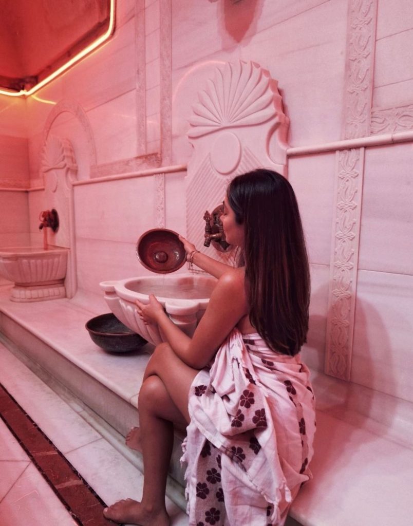 Marble hammam interior with heated gobektasi stone and traditional Turkish tiles