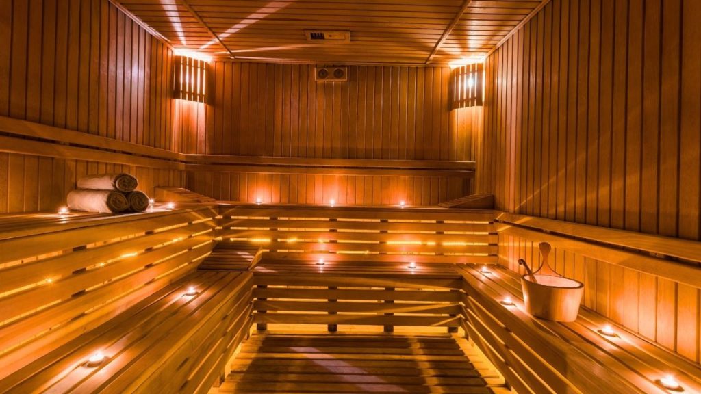 Candlelit wooden sauna room at Antalya Turkish bath experience