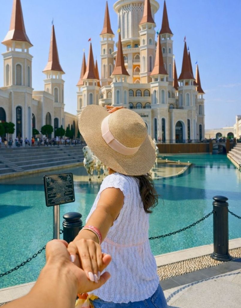 Land of Legends Belek fairy tale castle towers turquoise pool close view