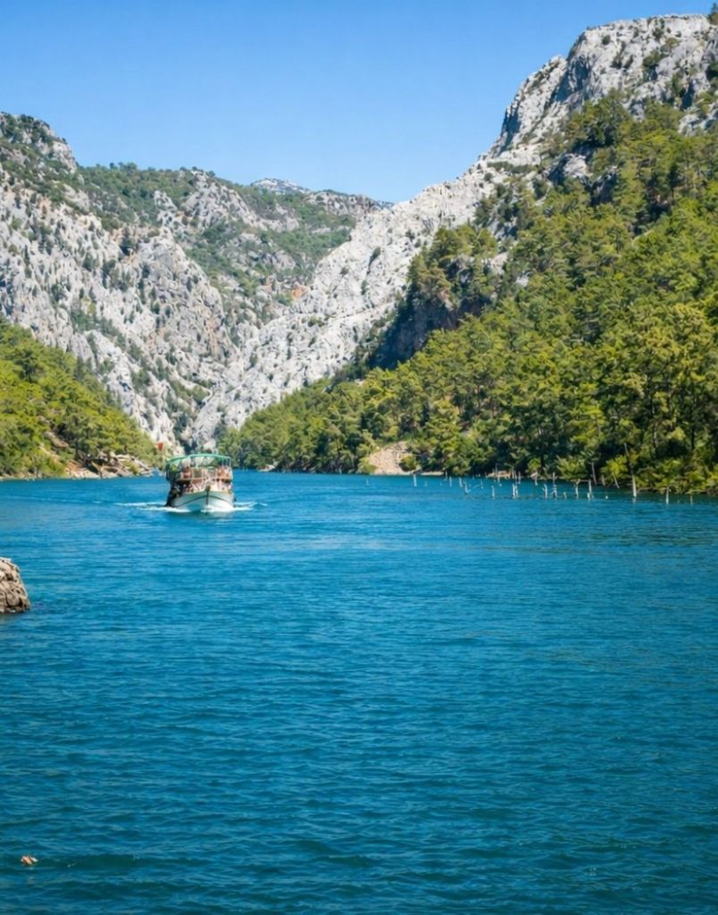 Boat navigating through the scenic Green Canyon lake with pine-covered mountains
