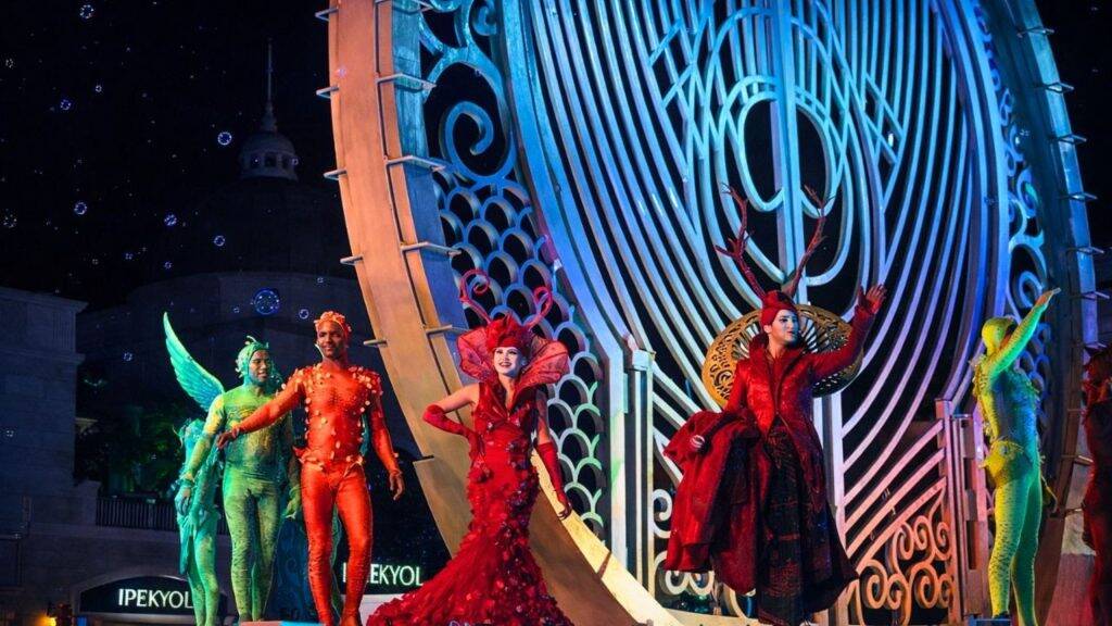 Colorful costumed performers on stage at Land of Legends Night Show in Antalya