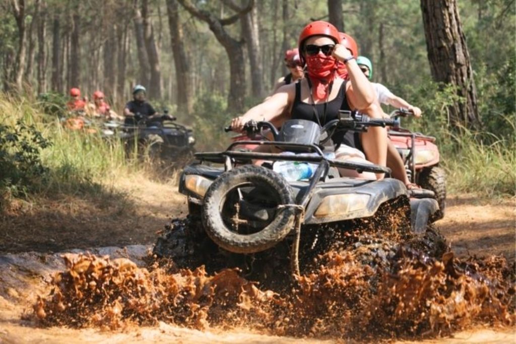 Antalya quad biking safari tour through forest trails with river crossings and dusty off-road tracks