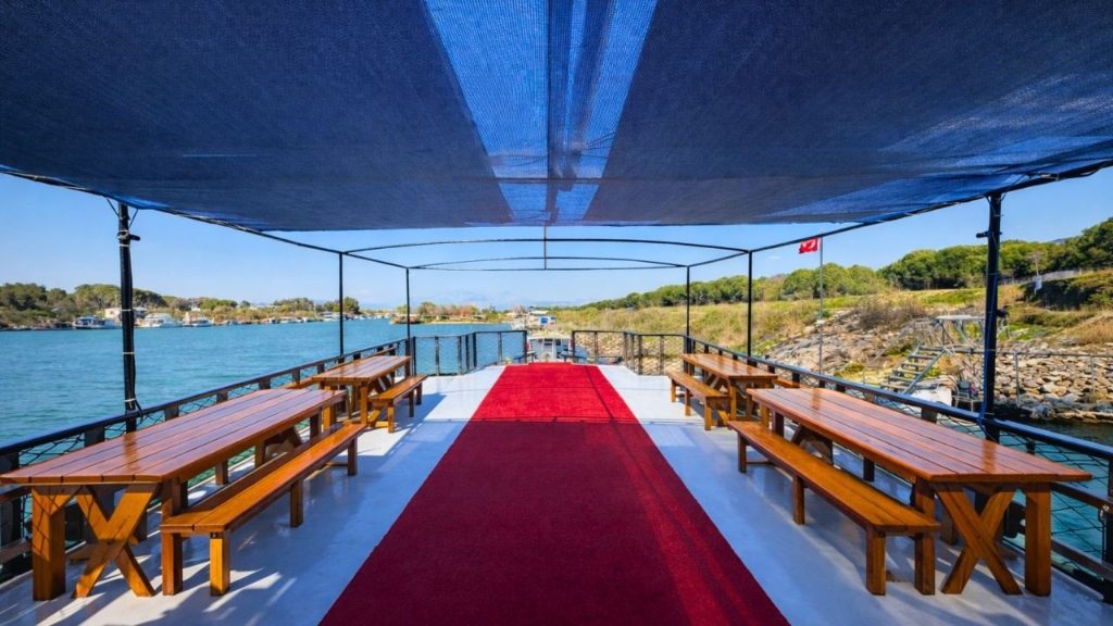 Spacious sun deck with benches on Antalya Waterfall Boat Trip tour boat
