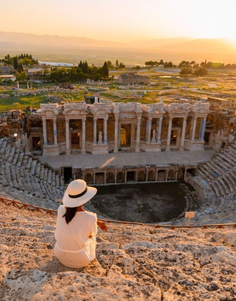 Visitor enjoying sunset at Hierapolis ancient theatre during a Pamukkale tour from Antalya