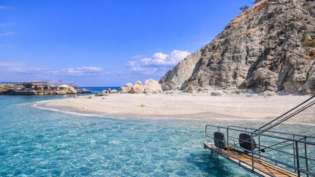 Sandy beach with crystal clear turquoise water at Suluada Island during boat trip from Antalya