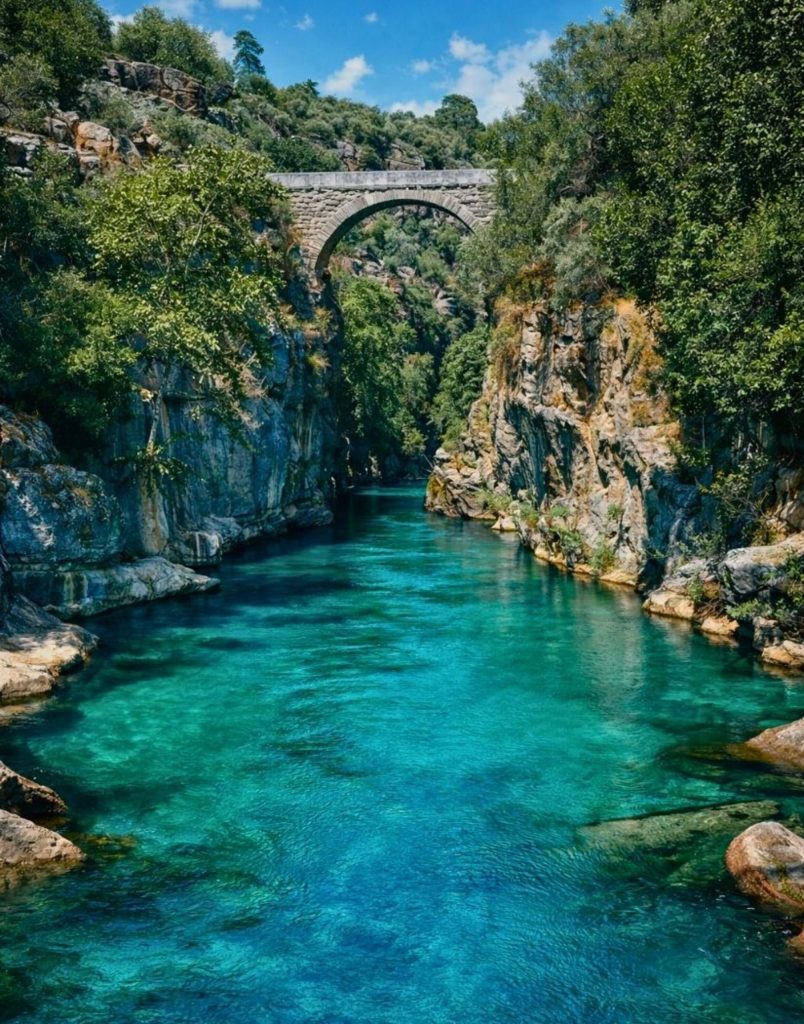 belek rafting koprulu canyon scenery with stone bridge turquoise water and rocky cliffs