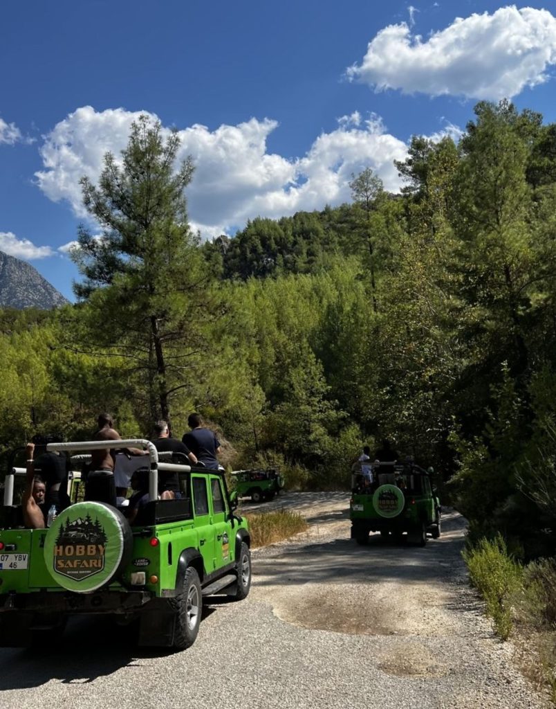 Jeep safari convoy driving through pine forest trails in Antalya Taurus Mountains