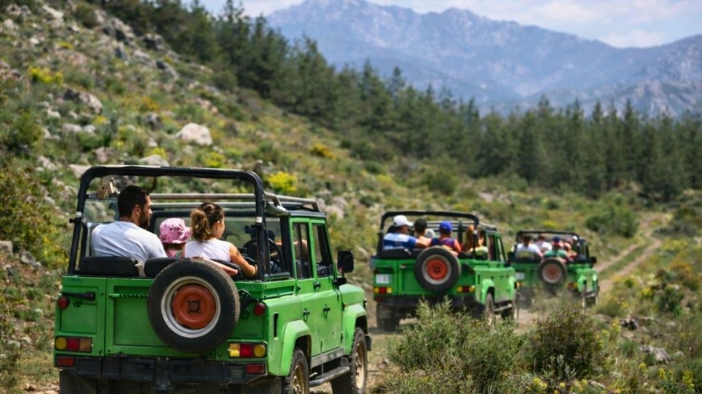 Open-top jeep convoy driving through Taurus Mountains on Antalya safari tour