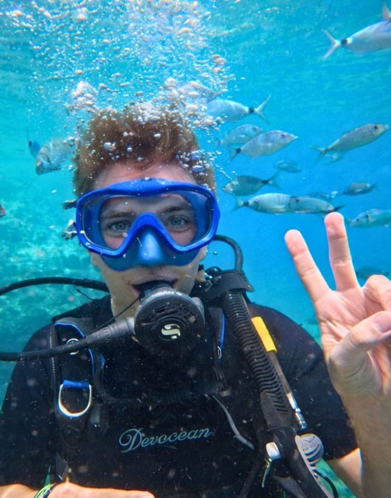 Belek scuba diving tour feeding friendly fish by hand underwater close encounter