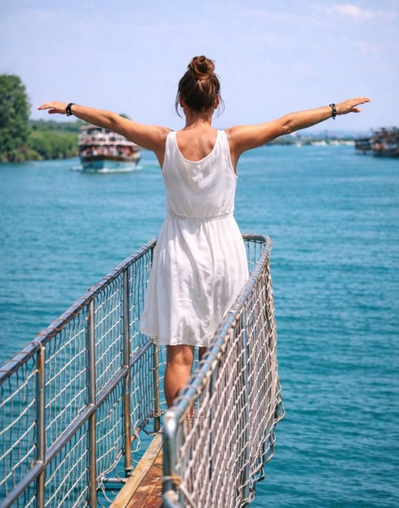 Enjoying freedom on the bow of Manavgat River boat tour with turquoise water views