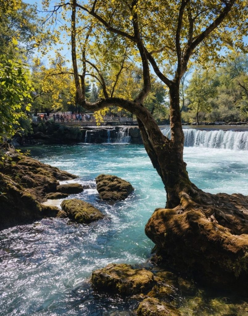 Manavgat Waterfall flowing through rocks and trees with turquoise water in natural setting