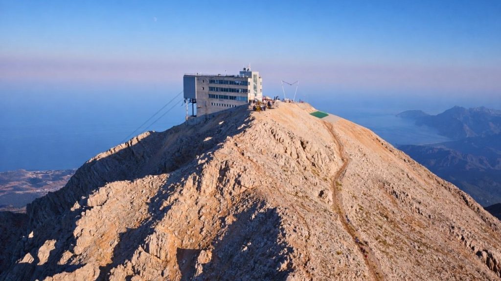 olympos cable car tahtali mountain summit station with mediterranean sea and mountain panorama