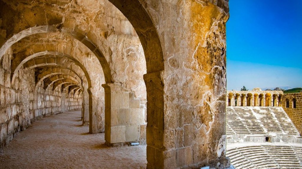 Ancient stone arches and corridors inside Aspendos Theatre during Perge Aspendos Side tour