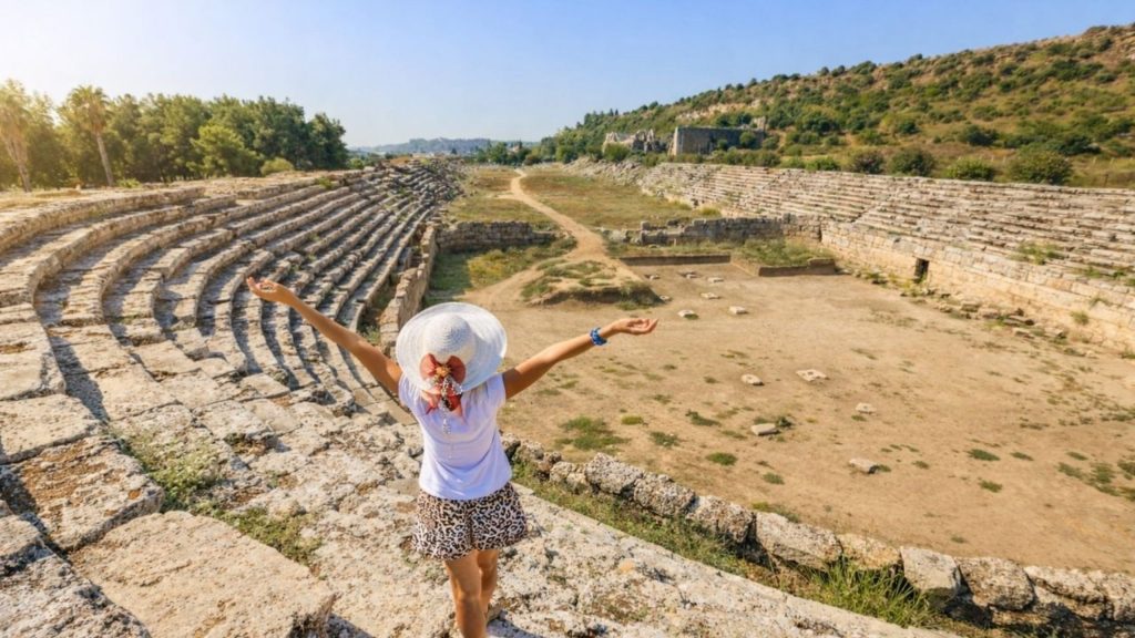 Visitor enjoying the ancient stadium of Perge during Perge Aspendos Side tour from Antalya