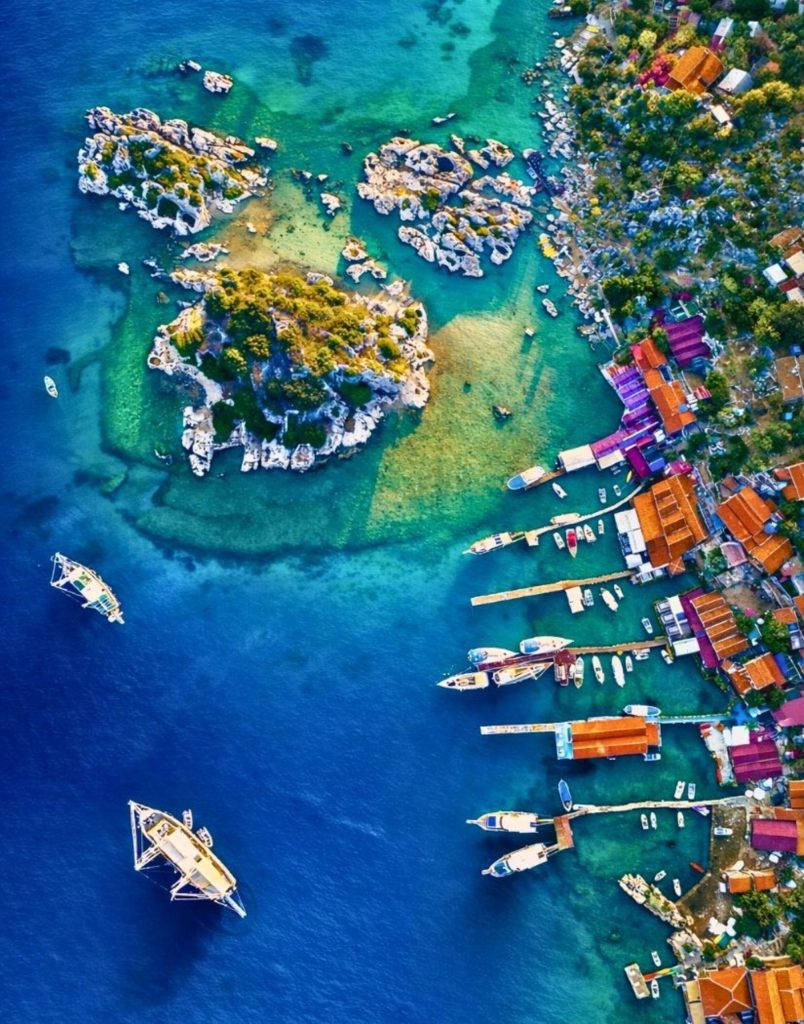 Aerial view of Kekova sunken city ruins visible through turquoise Mediterranean water