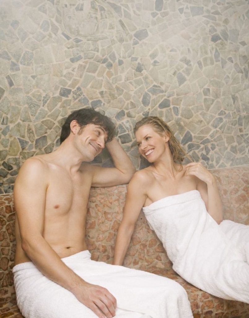 Steam room relaxation area with natural stone walls at Belek Turkish bath