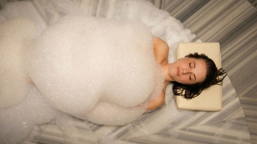Foam massage on heated marble gobek tasi stone at Belek Turkish bath