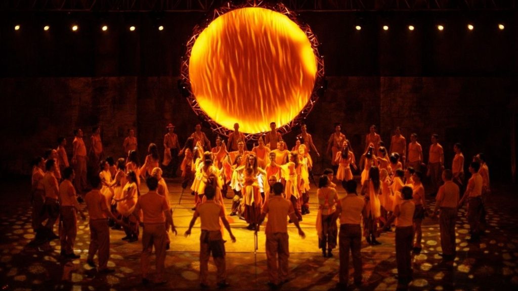 120 dancers performing around iconic fire circle at Fire of Anatolia show Aspendos Arena