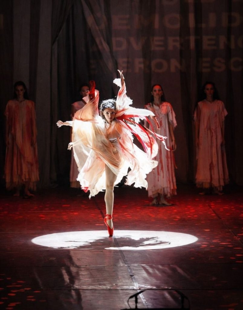 Ballet dancer spinning in spotlight at Fire of Anatolia show Aspendos Arena