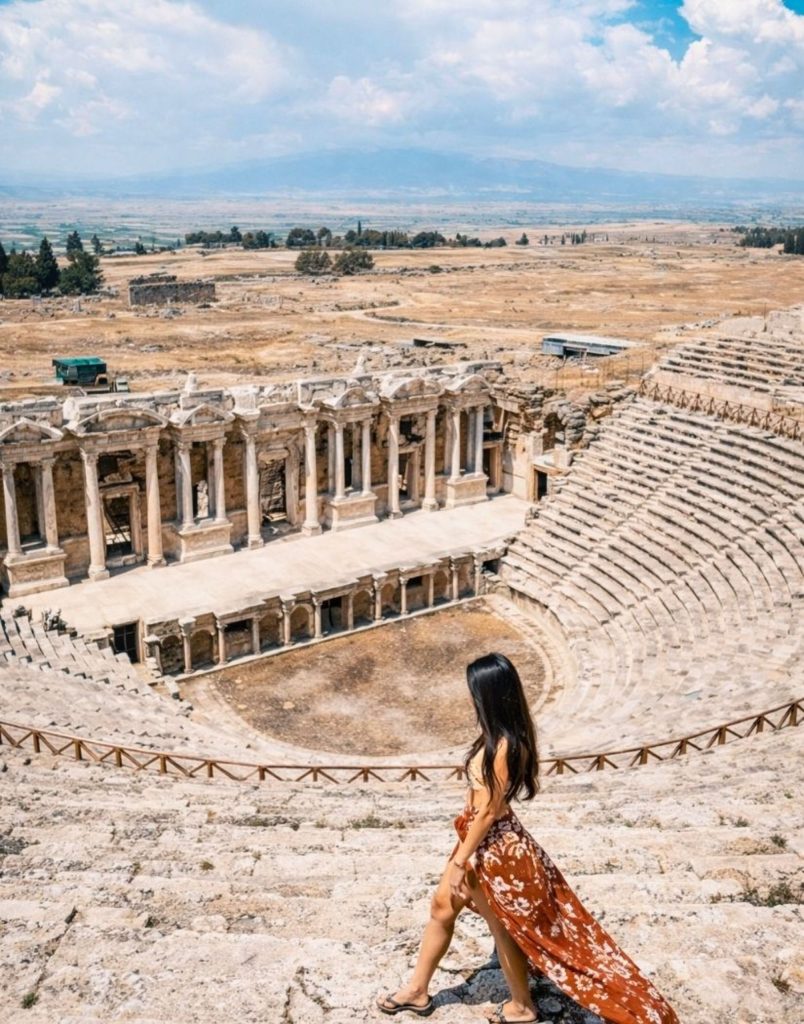Hierapolis ancient theatre with stage columns and wide valley panorama Pamukkale