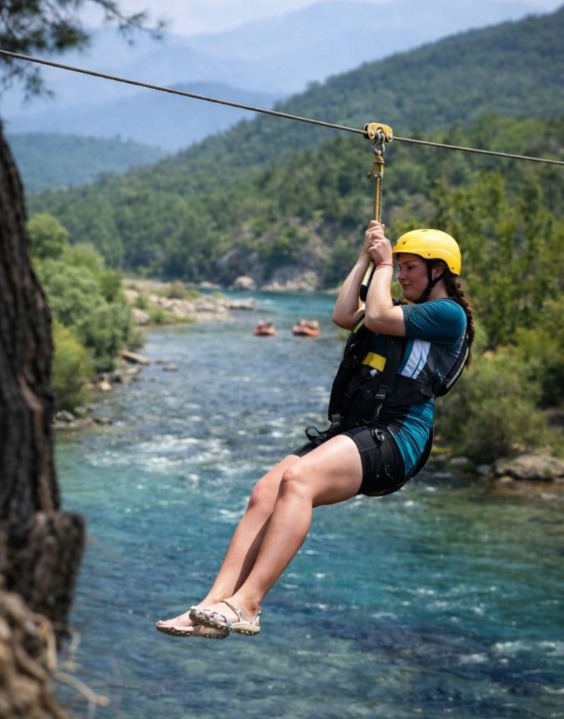 Antalya zipline over turquoise Koprulu Canyon river with Taurus Mountains in background