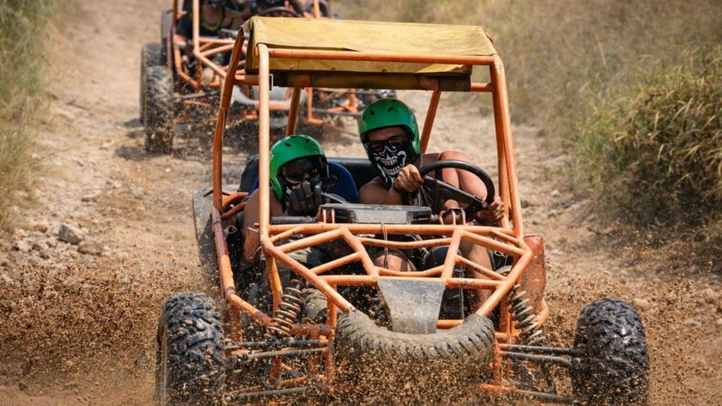 Antalya buggy safari convoy racing through dusty off-road forest trail on combo adventure tour