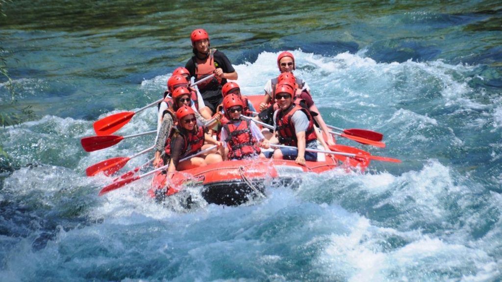 Antalya Koprulu Canyon white water rafting group paddling through rapids on combo adventure tour